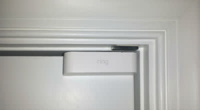 Contact Sensor (1st Gen) horizontally mounted on a door inside a home. 