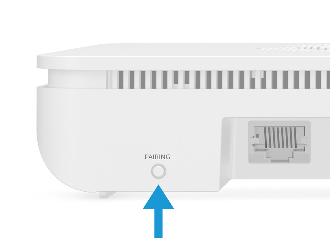 The back of the Ring Alarm Base Station with a blue arrow pointing up to the pairing button.