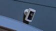White Ring Security Camera mounted on wall in dark setting