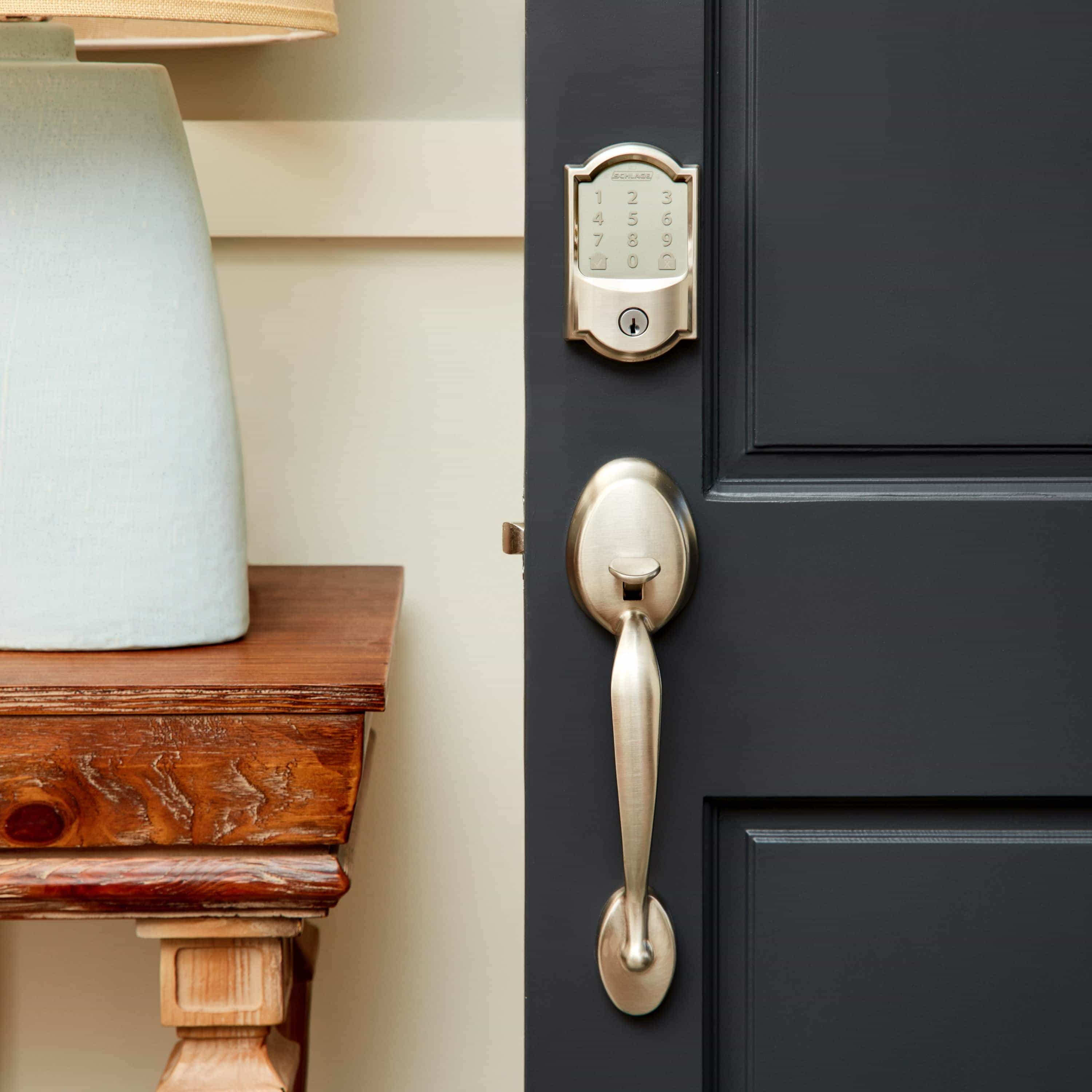 Schlage Encode Smart WiFi Deadbolt with Camelot Trim (for Works with Ring Video Doorbells and Cameras) - Schlage Encode Smart Wi-Fi Deadbolt with Camelot Trim on dark door, shown with handle set and keypad for keyless entry.