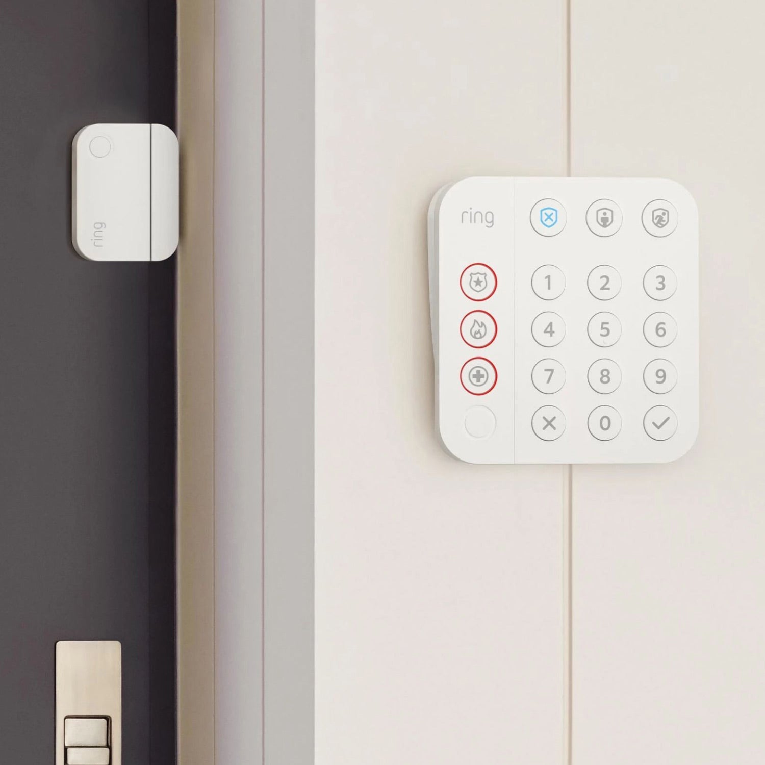 8-Piece Alarm Security Kit + Indoor Cam (2nd Gen) - Ring Alarm Keypad mounted near door equipped with a Door/Window Contact Sensor, part of 8-Piece Alarm Security Kit.