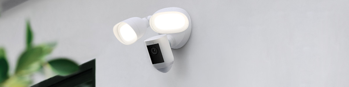 White Ring Floodlight Cam mounted on a white wall