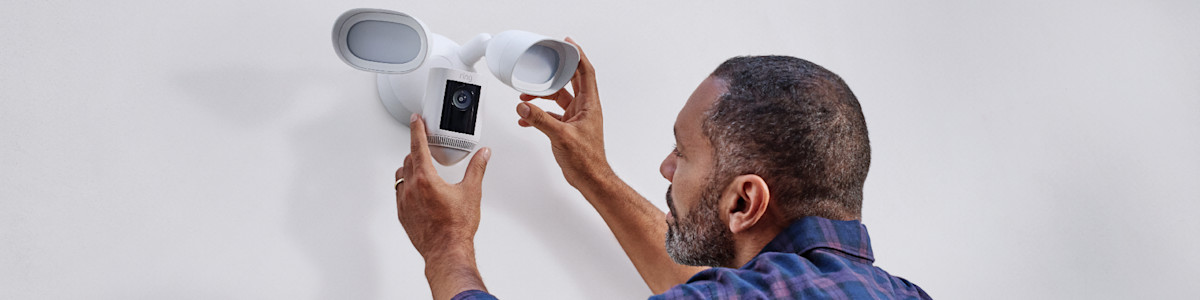 Installing a Ring security Floodlight Cam on an exterior wall