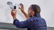 Installing a Ring security Floodlight Cam on an exterior wall