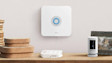 Ring security devices and Ring Alarm Base Station on wooden shelf