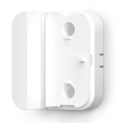 A Contact Sensor riser with no sensor attached to it and the included magnet.