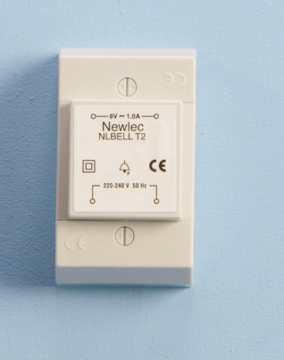 Newtec NLBELL T2 doorbell transformer, 8V 1.0A, 230-240V 50Hz input, with CE certification marking, mounted on a white surface.